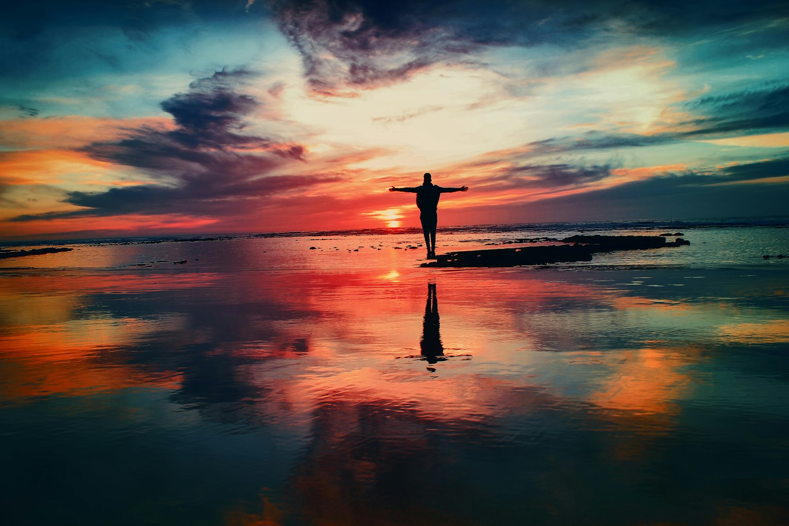 Open hands raised toward morning light